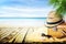 Vintage suticase, sunglasses and hipster hat on sand with seashells with blur seaside background. Summer paradise tropic travel