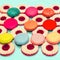 Vintage sweet colorful macaroons and berries cakes