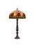 Vintage table lamp with decorative stained glass shade. 3D rendering isolated on white with clipping path