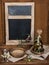 Vintage table setting with olives and and antique blackboard on