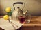 Vintage teapot with lemons and tea