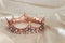 Vintage tiara over white delicate silk. Wedding concept