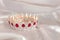 Vintage tiara over white delicate silk. Wedding concept