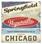 Vintage tin sign collection with USA cities. Springfield. Naperville. Chicago. Retro souvenirs.