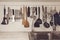 Vintage tone of Kitchen cooking utensils on rack