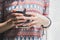 Vintage tone, soft focus, Asian girl\'s hand holding cup of coffee in the morning near the window