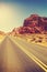 Vintage toned desert highway, travel concept, USA