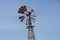 Vintage toned photo of an old western windmill tower, American wild west symbol .