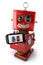 Vintage toy robot with smartphone