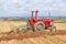 Vintage tractor and plough