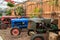 Vintage tractors parked in a barn