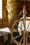 Vintage traditional spinning wheel, distaff with yarn in wooden