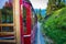 Vintage train eith red carriages cogwheel railway going to Schafberg Peak
