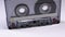 Vintage Transparent Audio Cassette Rotates on White Background