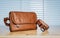 Vintage travelling for men`s accessories, brown bag and belt put