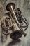 Vintage trumpets on a wooden surface