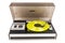 Vintage turntable record player with yellow vinyl