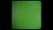 Vintage TV chromakey. Interference and flickering retro TV. Green screen with rounded edges and damaged film tape. 8mm