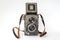 Vintage twin lens reflex camera with open viewfinder. Front view. R