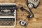 Vintage typewriter,camera and an old telephone on wooden table a