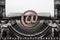 Vintage typewriter and an email symbol.