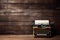 Vintage typewriter on rustic wooden background