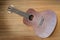 Vintage ukulele on wooden background