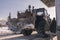 Vintage ussr tractor on petrolium station with chain winter time