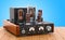 Vintage vacuum tube amplifier on the wooden table. 3D rendering