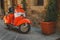 Vintage Vespa Piaggio parked in a street of a Tuscan town. Italy, 2017