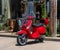 Vintage Vespa scooter sits in front of a french cafe in St Genevieve, Mo.