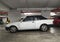 Vintage veteran rare white car Ford Escort 1.4 Ghia roadster parked