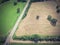 Vintage view Texas farmland prairie field bale hay on sunny day