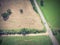 Vintage view Texas farmland prairie field bale hay on sunny day