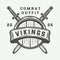 Vintage vikings motivational logo, label, emblem, badge