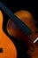 Vintage violin and wooden guitar on dark background