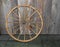 Vintage wagon wheel against wall