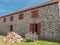 Vintage wagon, wood and stone building