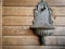 A vintage washing basin on a unpainted wooden wall