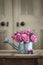 Vintage watering can with roses