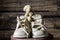 vintage white leather baby shoes with small stuffed teddy bear