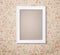 Vintage white photoframe on french fashioned wallpaper