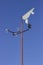 Vintage wind vane on blue sky