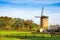 Vintage windmill in the rural countryside. Zeddam, The Netherlands