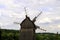 Vintage windmills on green field in in the ethnopark