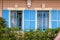 Vintage windows with blue shutters in old house, Provence, Franc