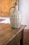 Vintage wine bottle basket in old house