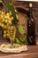 Vintage wine glass against background bunch of grapes and cooper