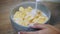 Vintage woman in white breakfast cooking with flakes and milk. Diet, mousse, cornflakes - the concept of healthy eating