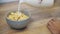 Vintage woman in white breakfast cooking with flakes and milk. Diet, mousse, cornflakes - the concept of healthy eating